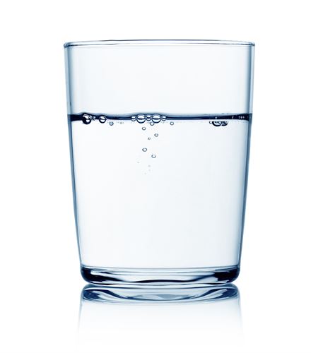 A clear glass of water 3/4 full