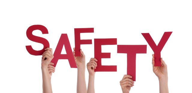 Each letter of the word "safety" held up by a hand